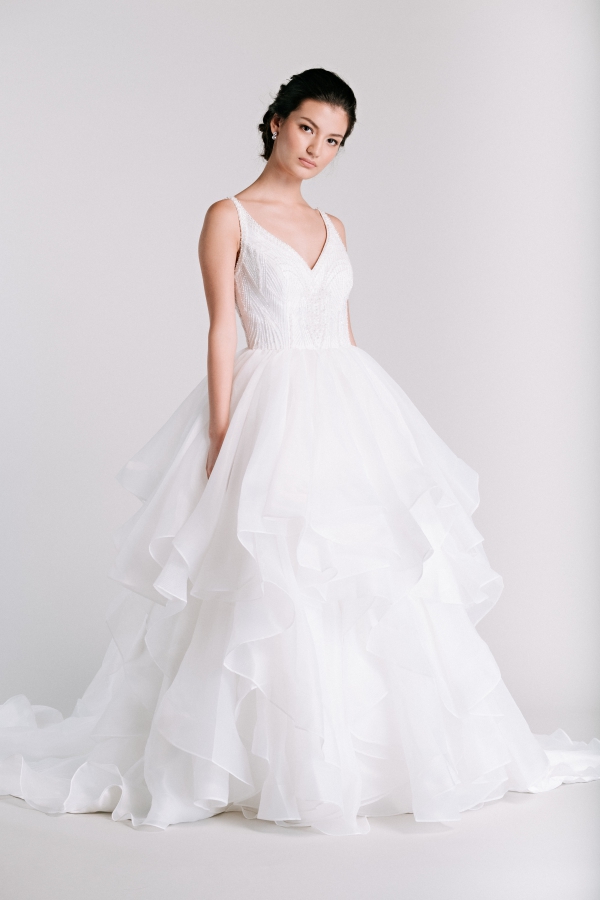 spaghetti straps ruffled skirt horsehair rtw wedding gown from Ivory & White Bridal Store