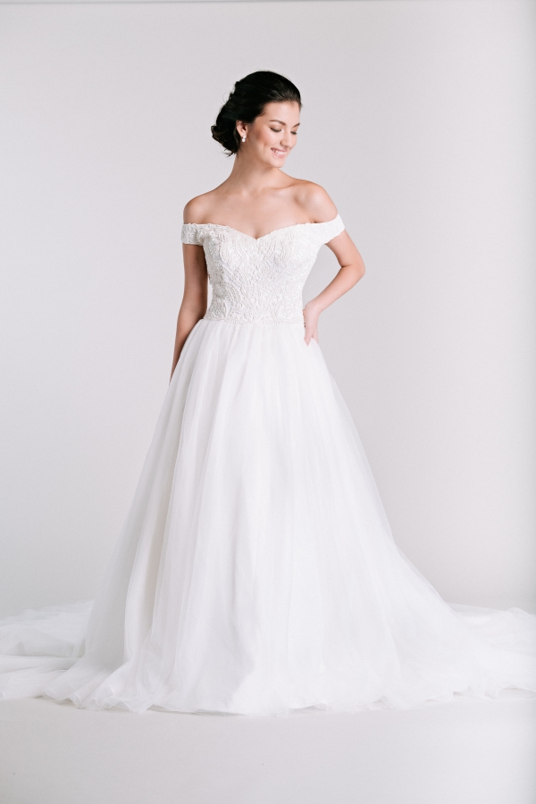 off shoulder beaded wedding gown by Ivory & White Bridal Store