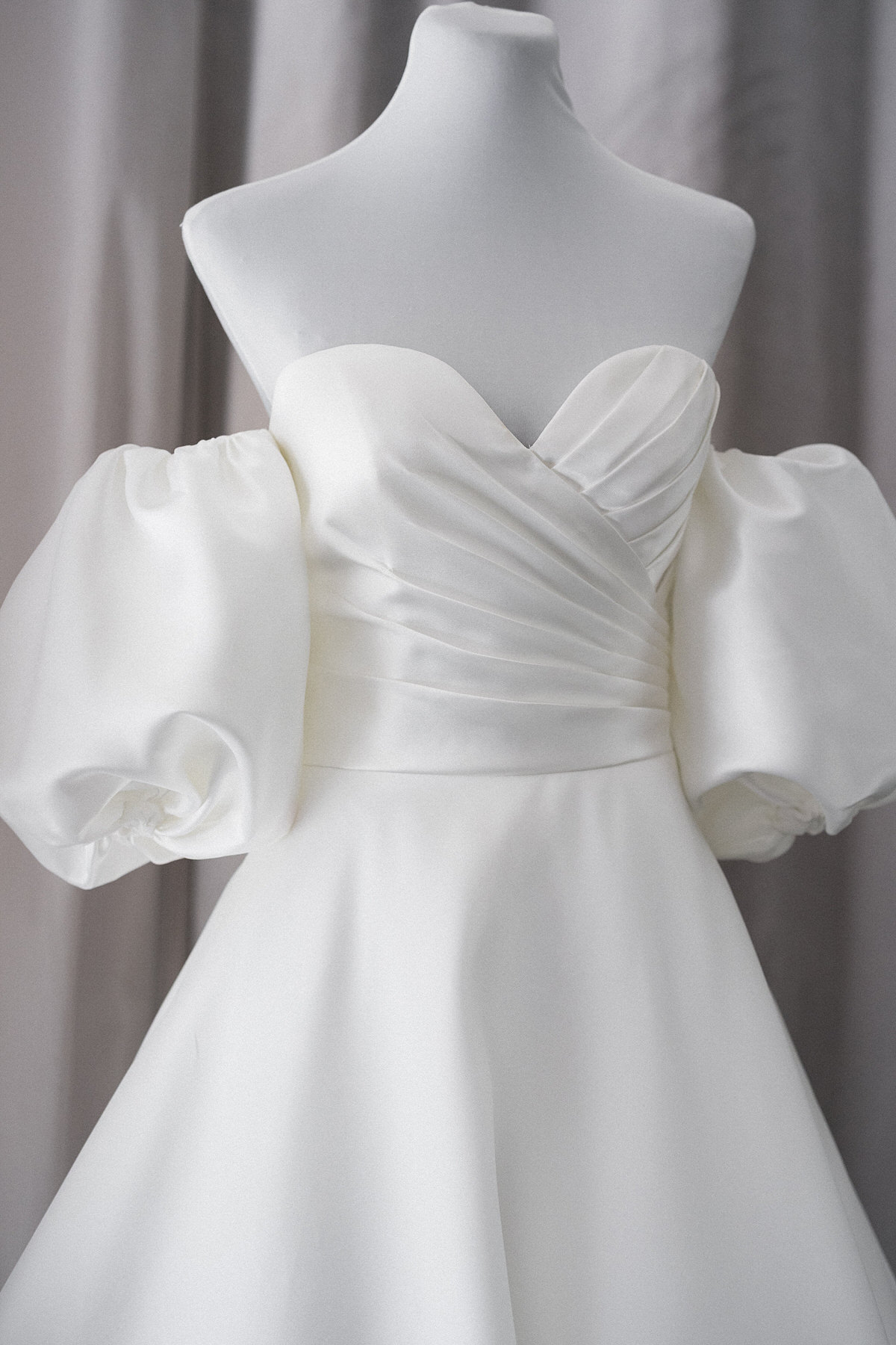 minimalist strapless mikado wedding gown with puff sleeves